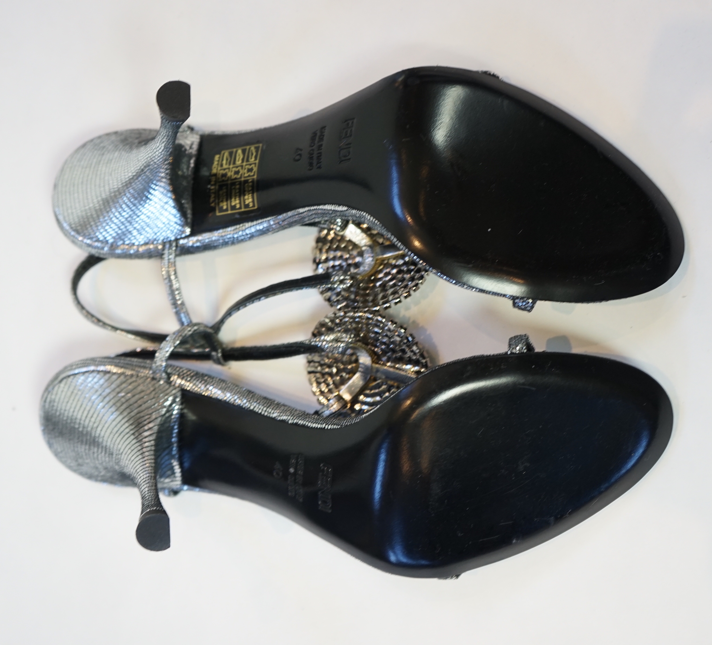 A pair of Fendi lady's metallic silver sandals with three diamante circle detail and a pair of Dolce and Gabbana silver patent leather and suede peep toe heels, size EU 39/40